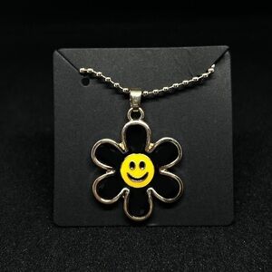 Unisex gold and black Flower pendant necklace Brand new.